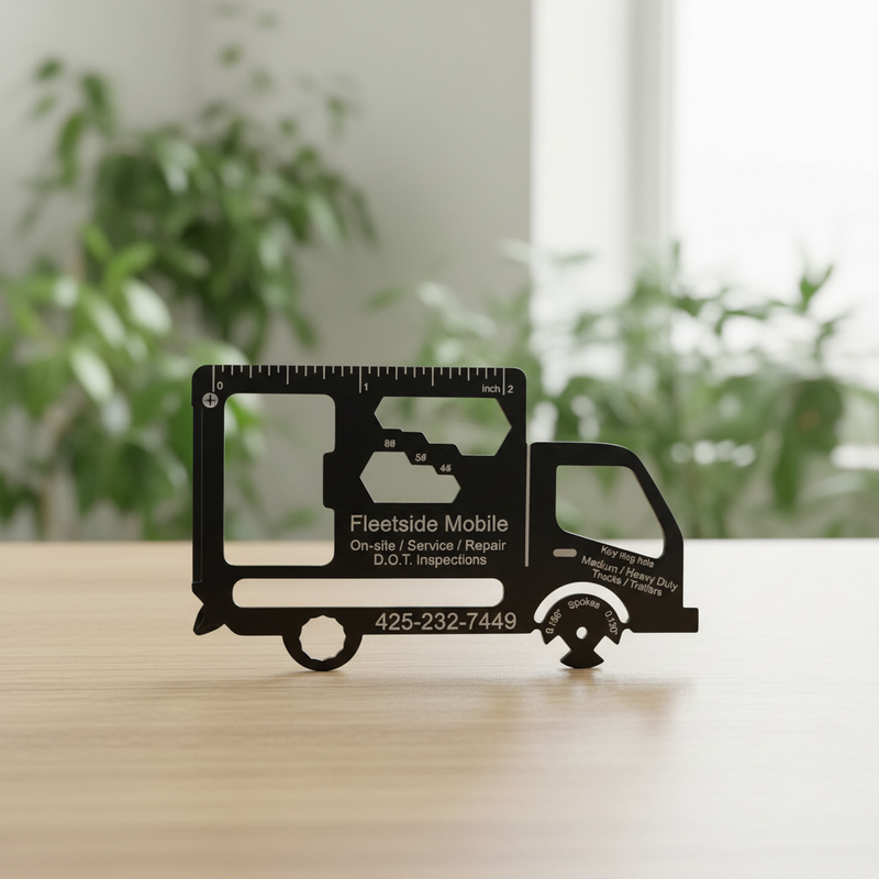 Multifunctional tool shaped like a truck on a wooden surface with plants in the background. custom branded for promotional events