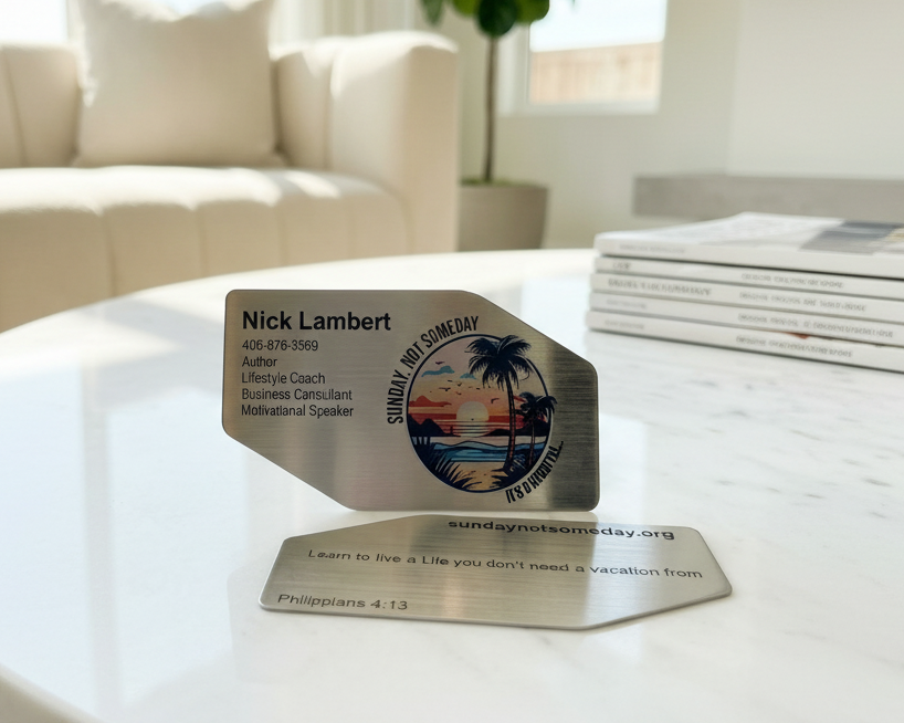 Metallic business cards on a table with a blurred background